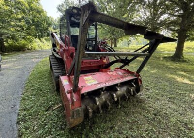 Tracked loader and forestry mulching head