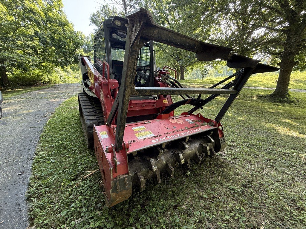Tracked loader and forestry mulching head