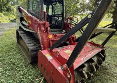 Forestry mulching attachment on the tracked loader