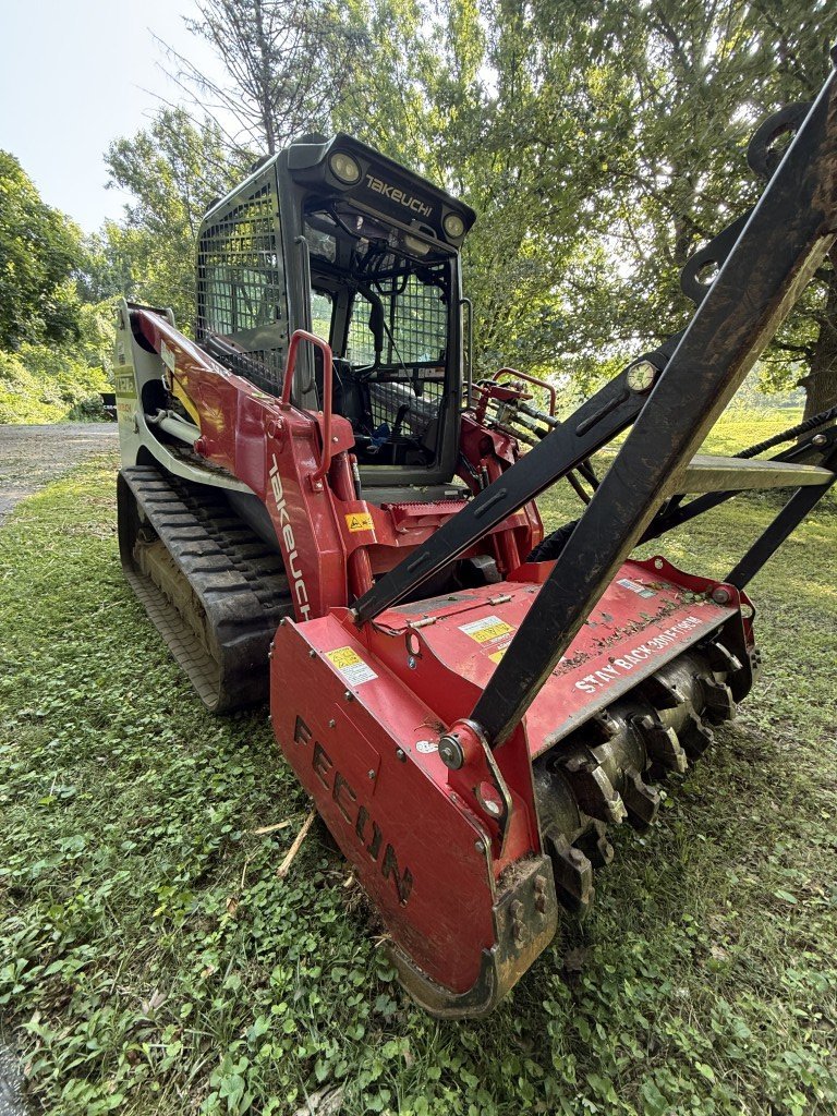 Forestry mulching attachment on the tracked loader